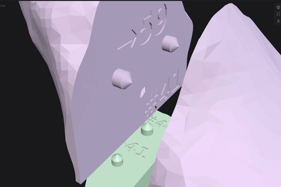 Cut faces with alignment pegs and an engraved part number